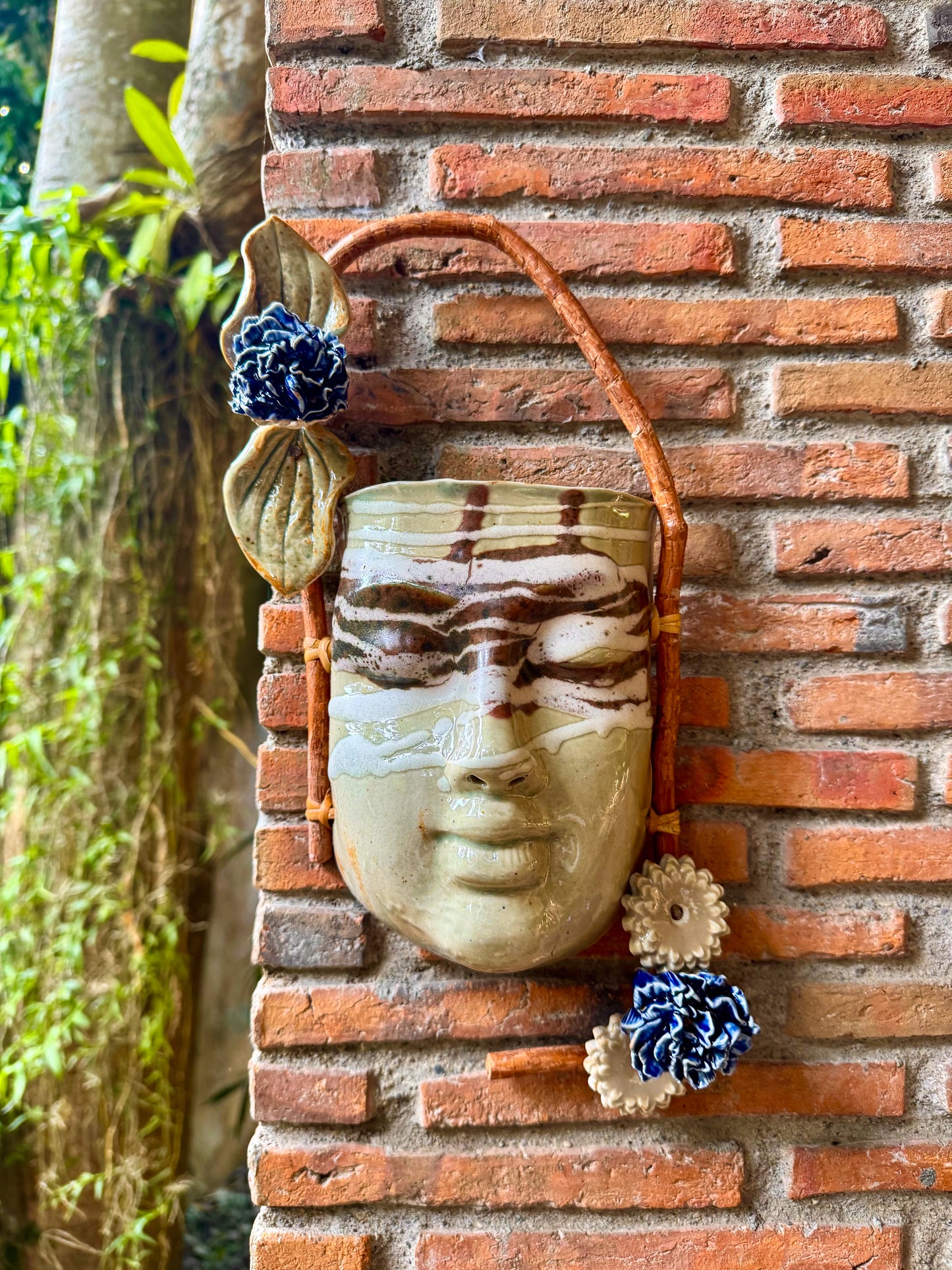 Mask w/ Flowers Wall Hang (White & Reddish Brown on Celadon Glaze)