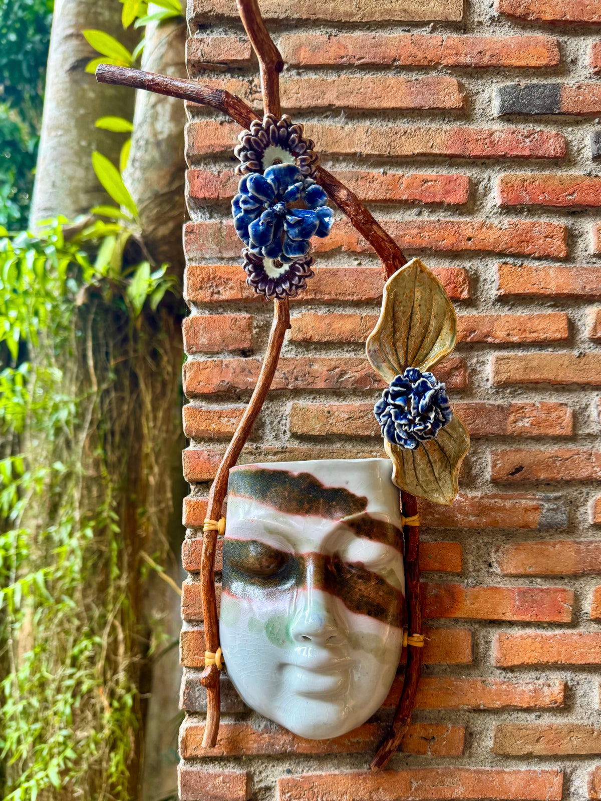 Mask w/ Flowers Wall Hang (Reddish Brown on White Glaze)
