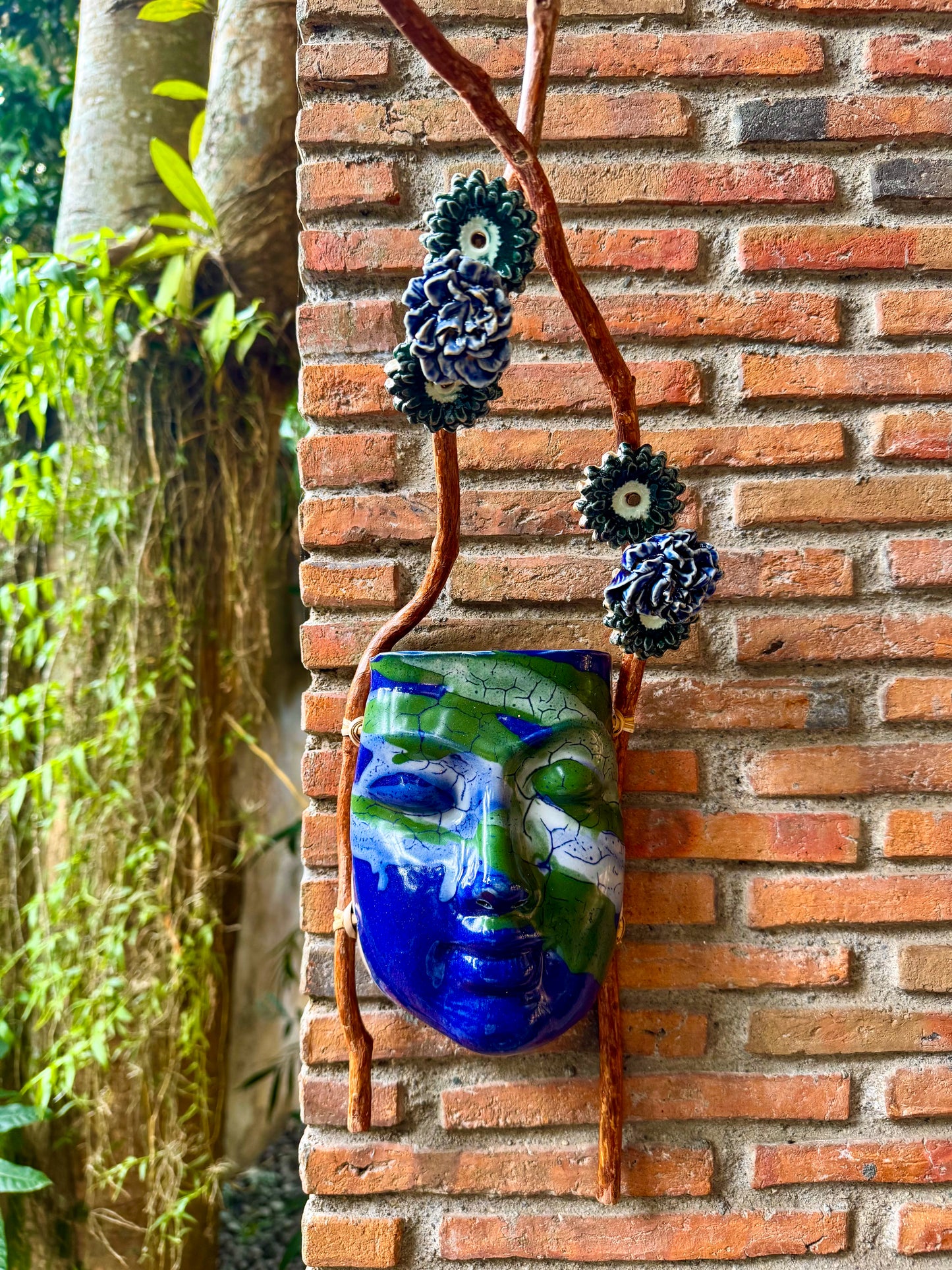 Mask w/ Flowers Wall Hang (Green & White on Blue Glaze)