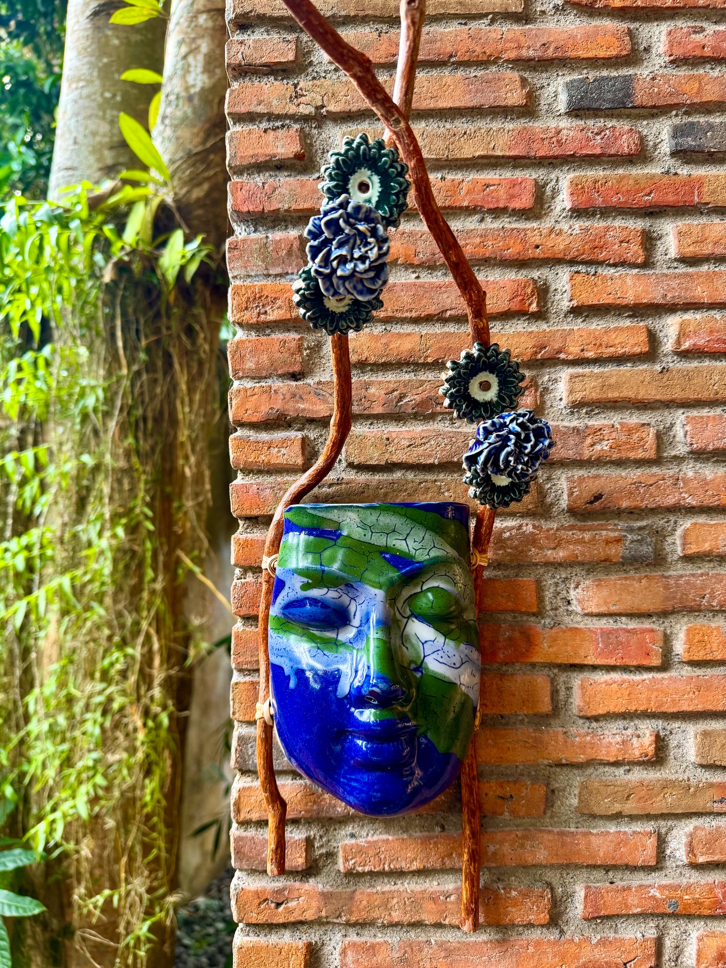Mask w/ Flowers Wall Hang (Green & White on Blue Glaze)